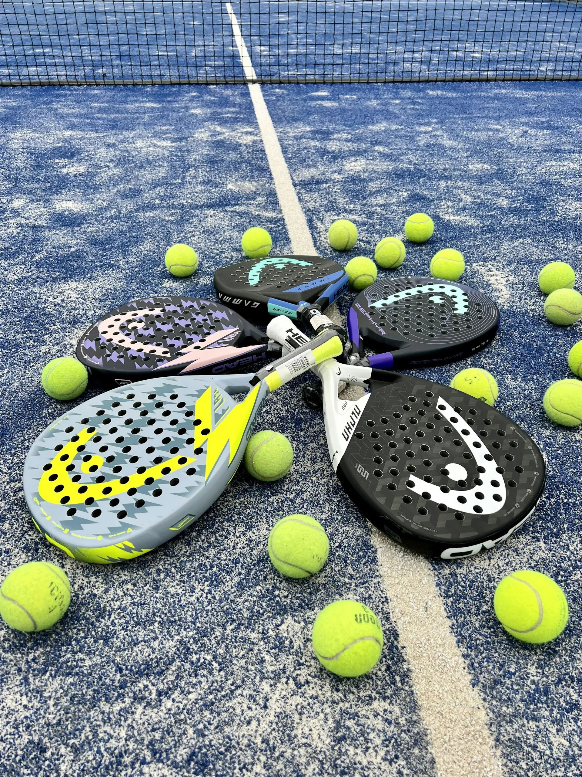 Padel rackets and balls on court