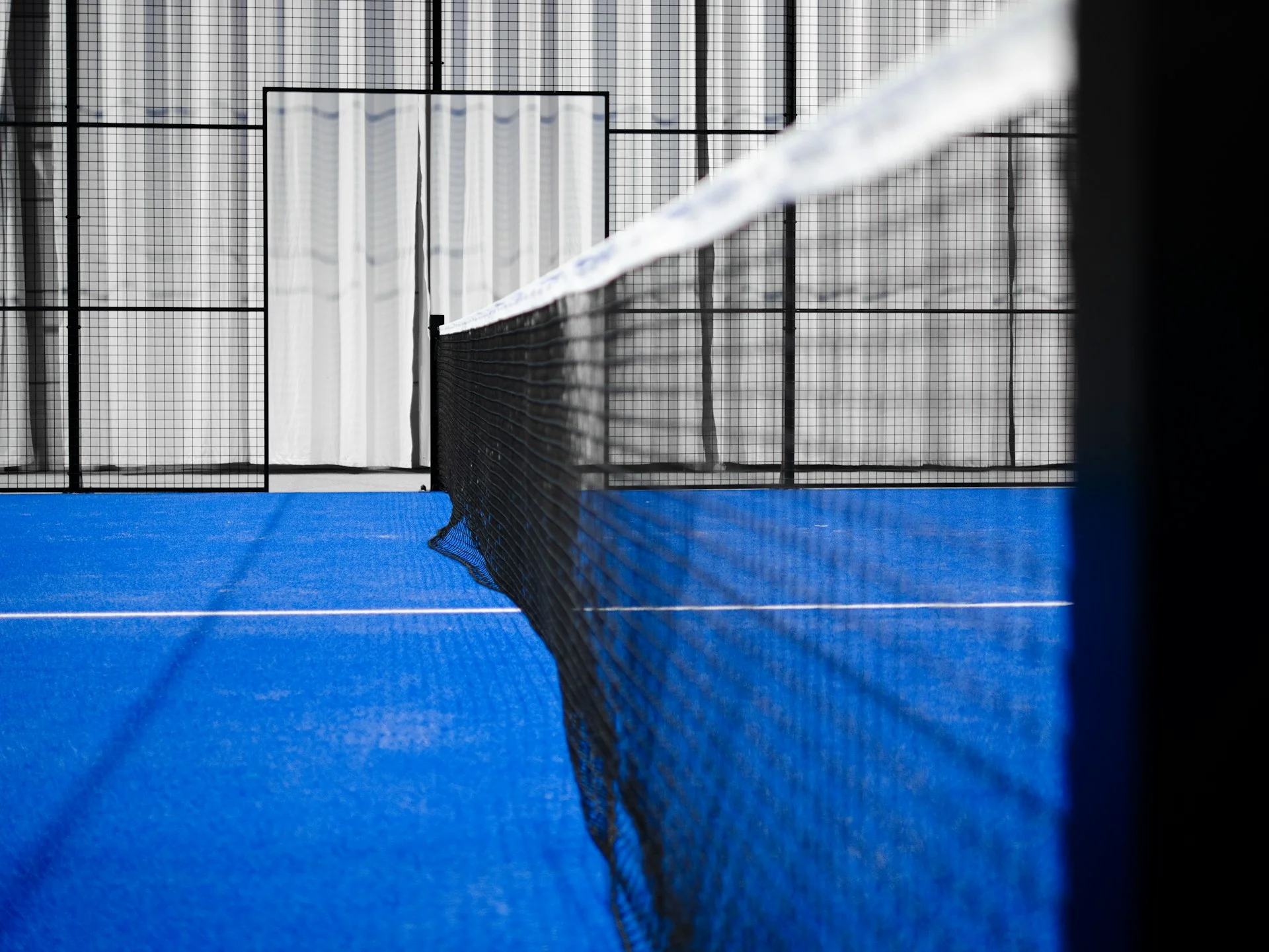 Padel court markings — white line on blue surface