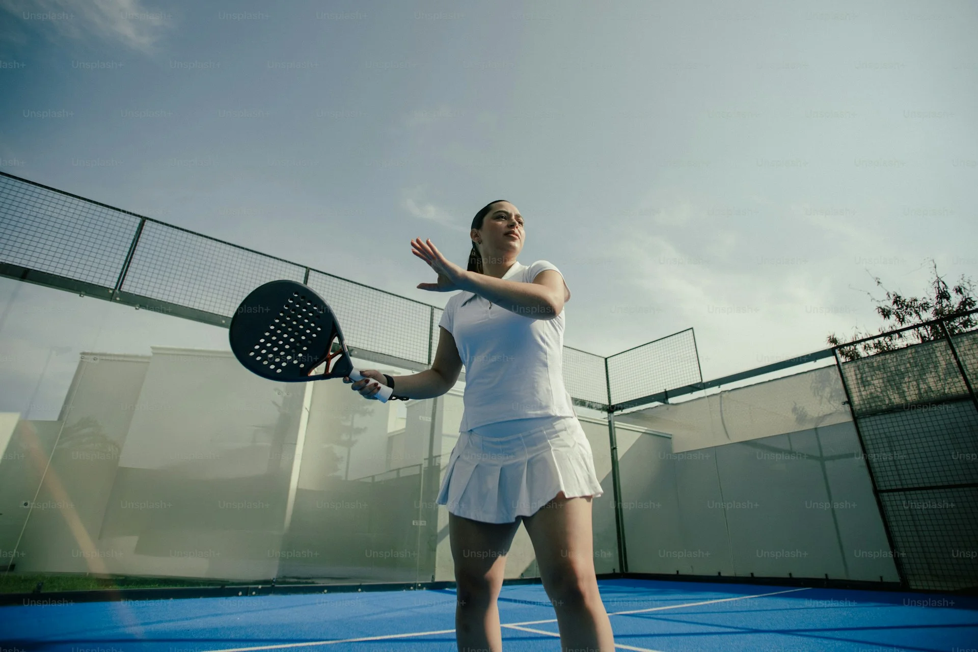 Player executing a powerful smash in padel