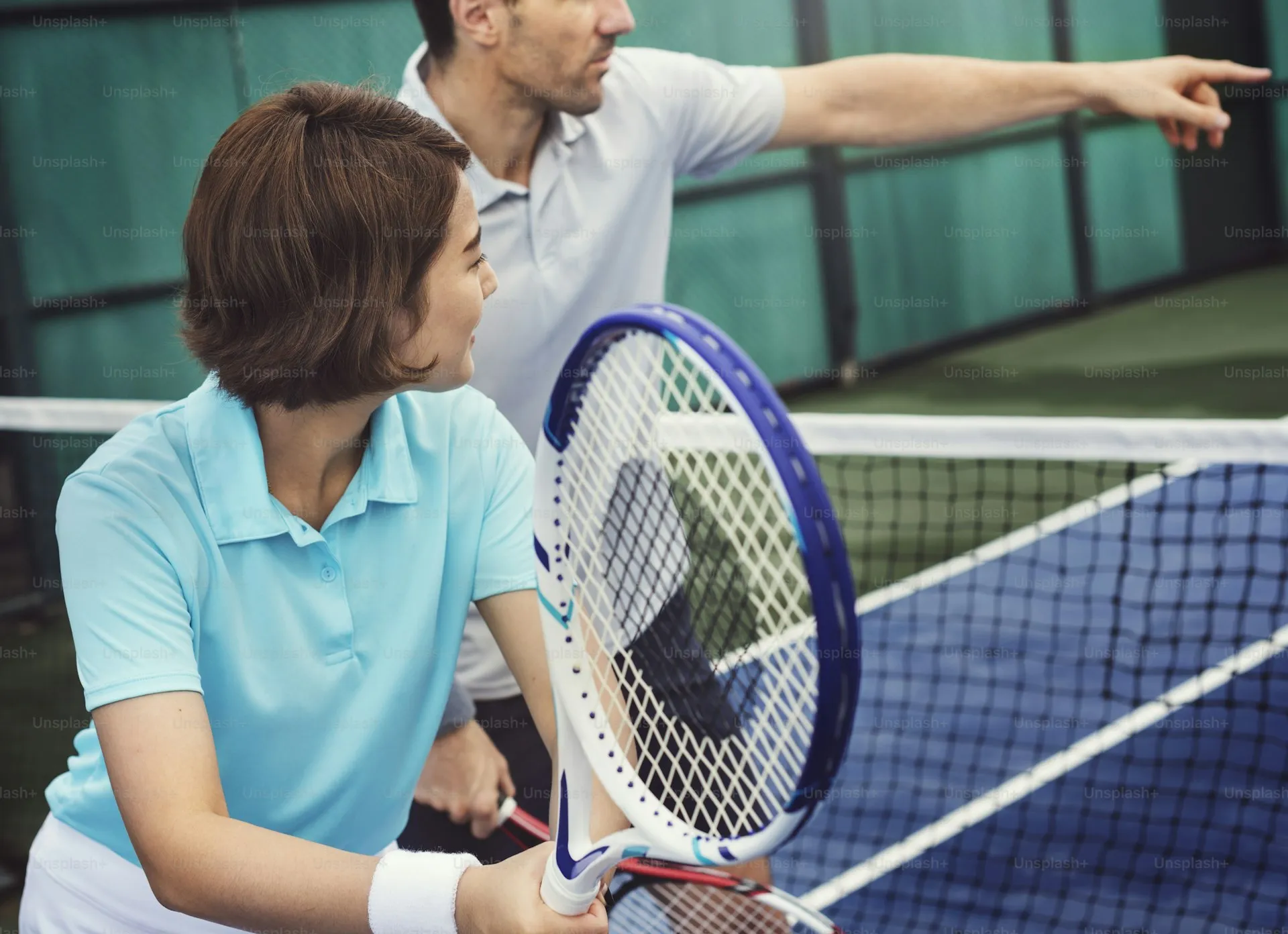 Coach training a padel player
